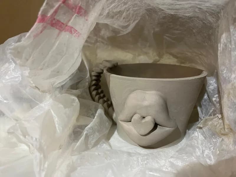 Lips cup in raw clay wrapped