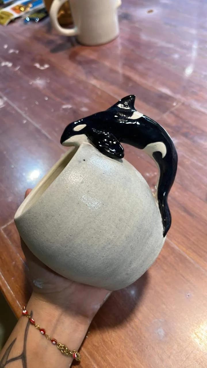 Mug with orca whale handle